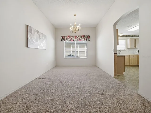 The formal dining room, just off the living room, provides ample space for a large table