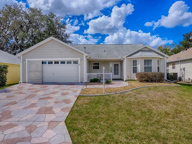 BOND PAID on this charming Cypress model 3-bedroom, 2-bath home with an enclosed Florida Room and 2-car garage is located in the desirable Village of Woodbury.