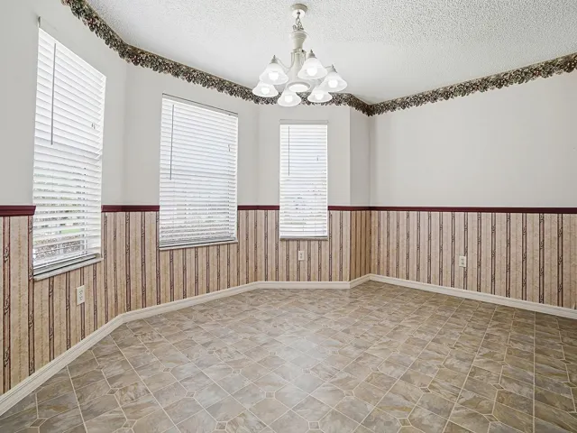 Adjacent to the kitchen, the dinette with bay window creates a bright and inviting space for casual dining
