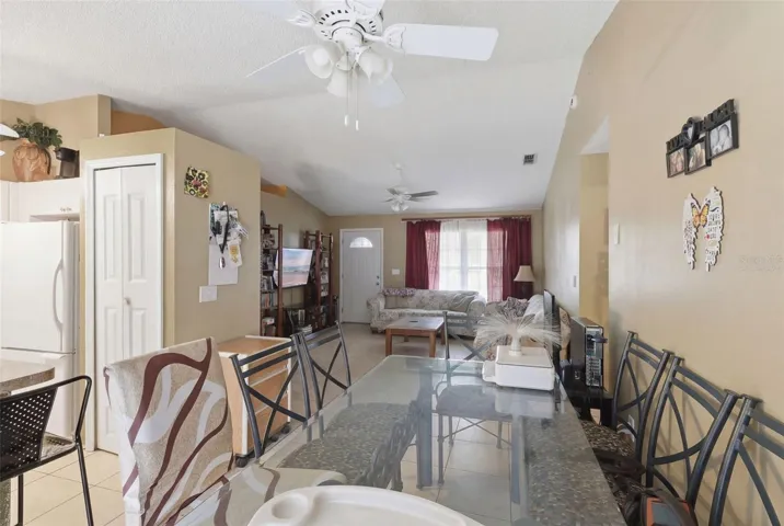 Virtually staged dining area looking towards living room