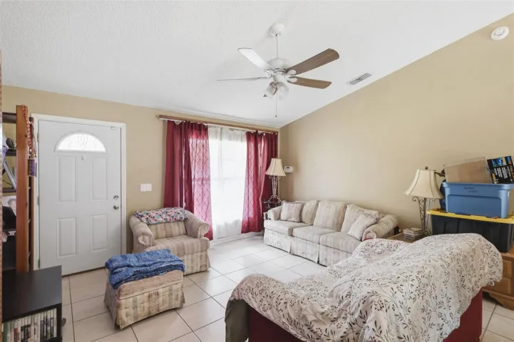 Living room with vaulted ceiling.