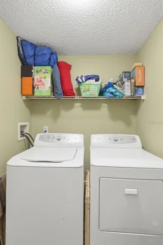 Laundry room, washer and dryer stay.