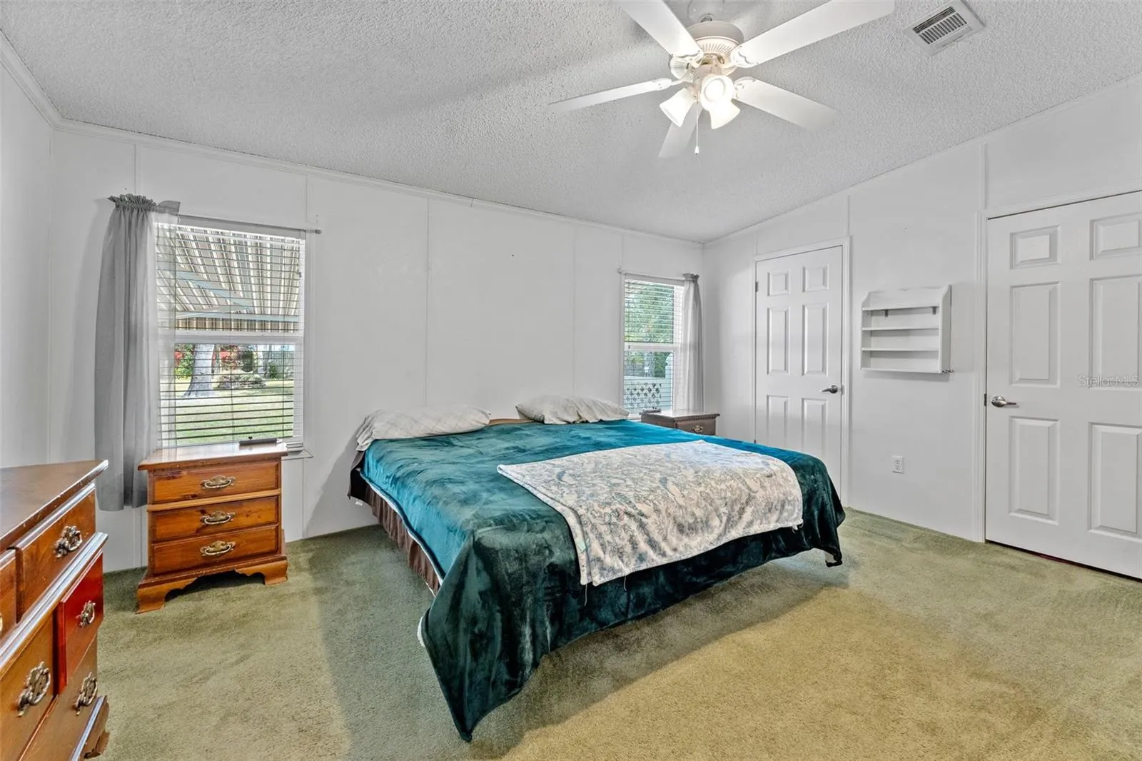 Primary Bedroom with a Ceiling Fan