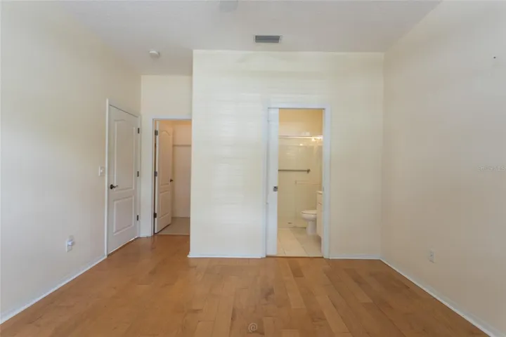 Primary bedroom w walk-in closet and en suite.
