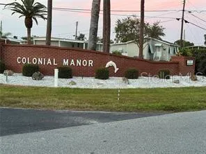 ENTRANCE TO COLONIAL MANOR