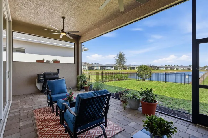 Patio overlooking backyard and pond