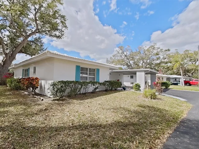 Nice corner lot provides privacy and shade.