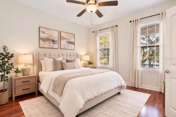 Upstairs, rear bedroom, with en-suite - Virtual staging added to demonstrate possible furniture placement.