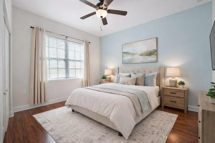 Upstairs front bedroom, with en-suite - Virtual staging added to demonstrate possible furniture placement.