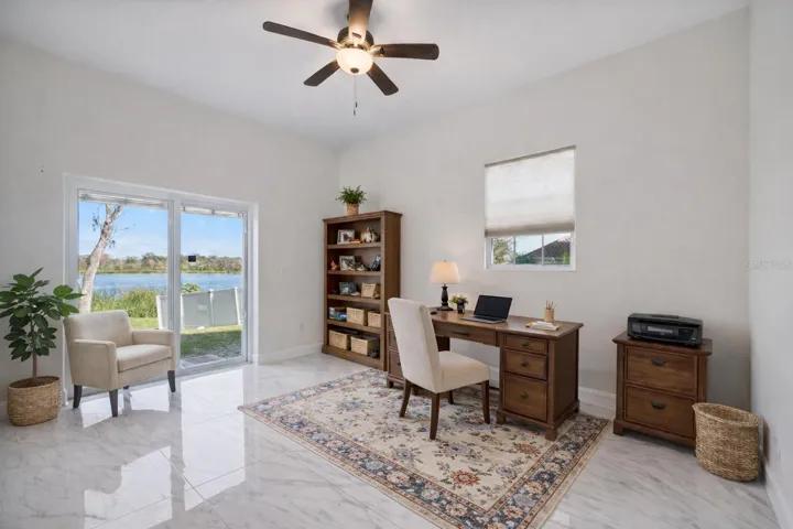 office/bedroom downstairs, includes closet and slider to back yard. Virtual staging added to demonstrate possible furniture placement.