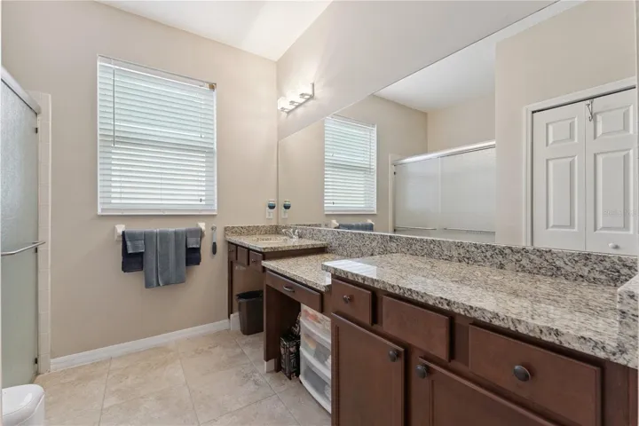 Primary Bathroom - Handicapped modified by original owner, the wheelchair assessable sink can easily be modified back with a replacement cabinet.