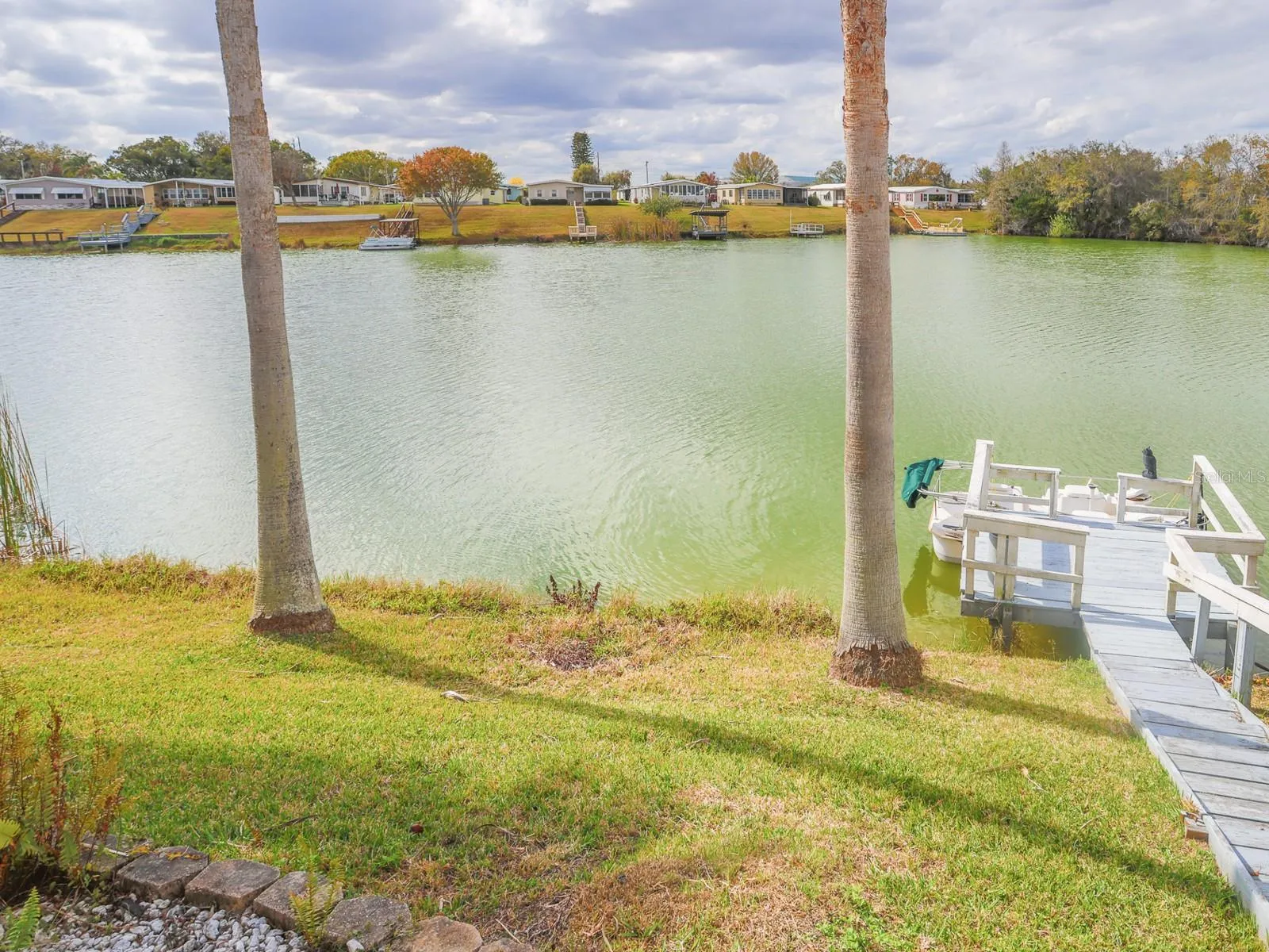 View of the lake from the back yard. Dock view.