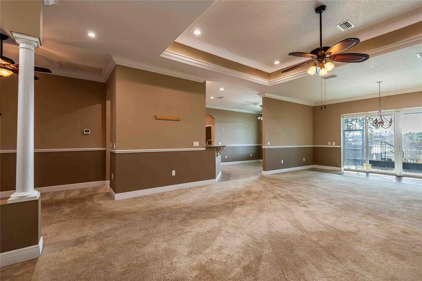 Living room with kitchen on left