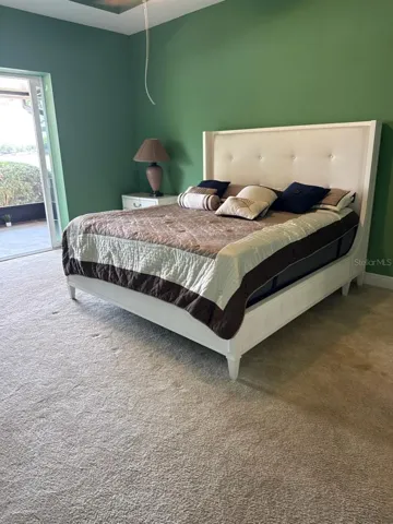 Master bedroom with sliding doors to lake