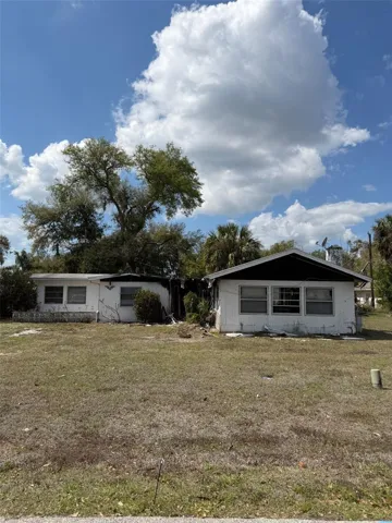 So much potential on this large lot in a great location!