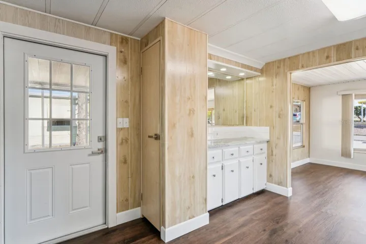 door from screened patio into kitchen / built-in coffee bar