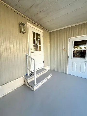 Entry to kitchen in screen patio