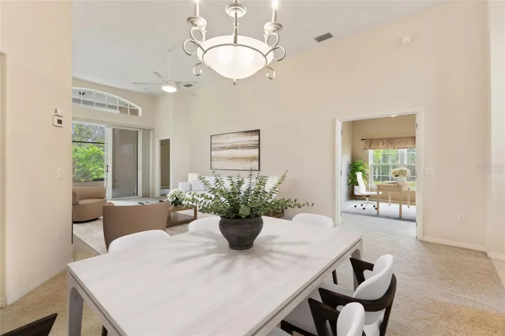 Virtually staged dining and living areas in Great Room and Office
