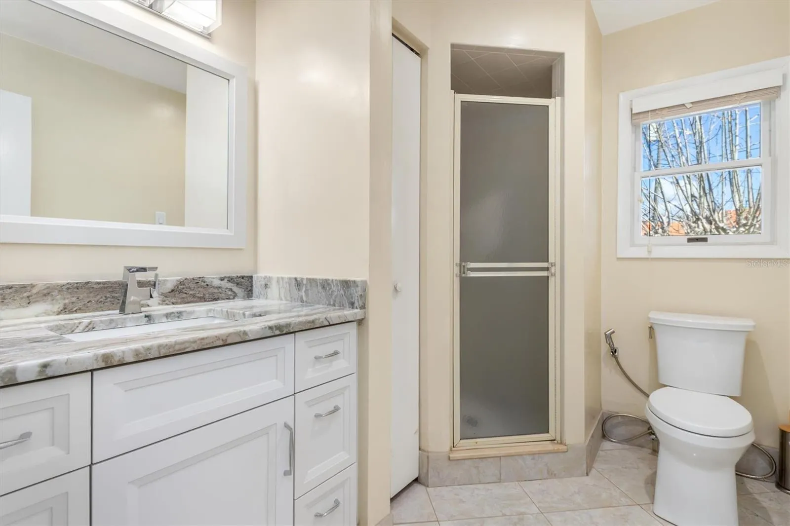 Bathroom 3 - Updated cabinets and Granite Counter Top with shower only