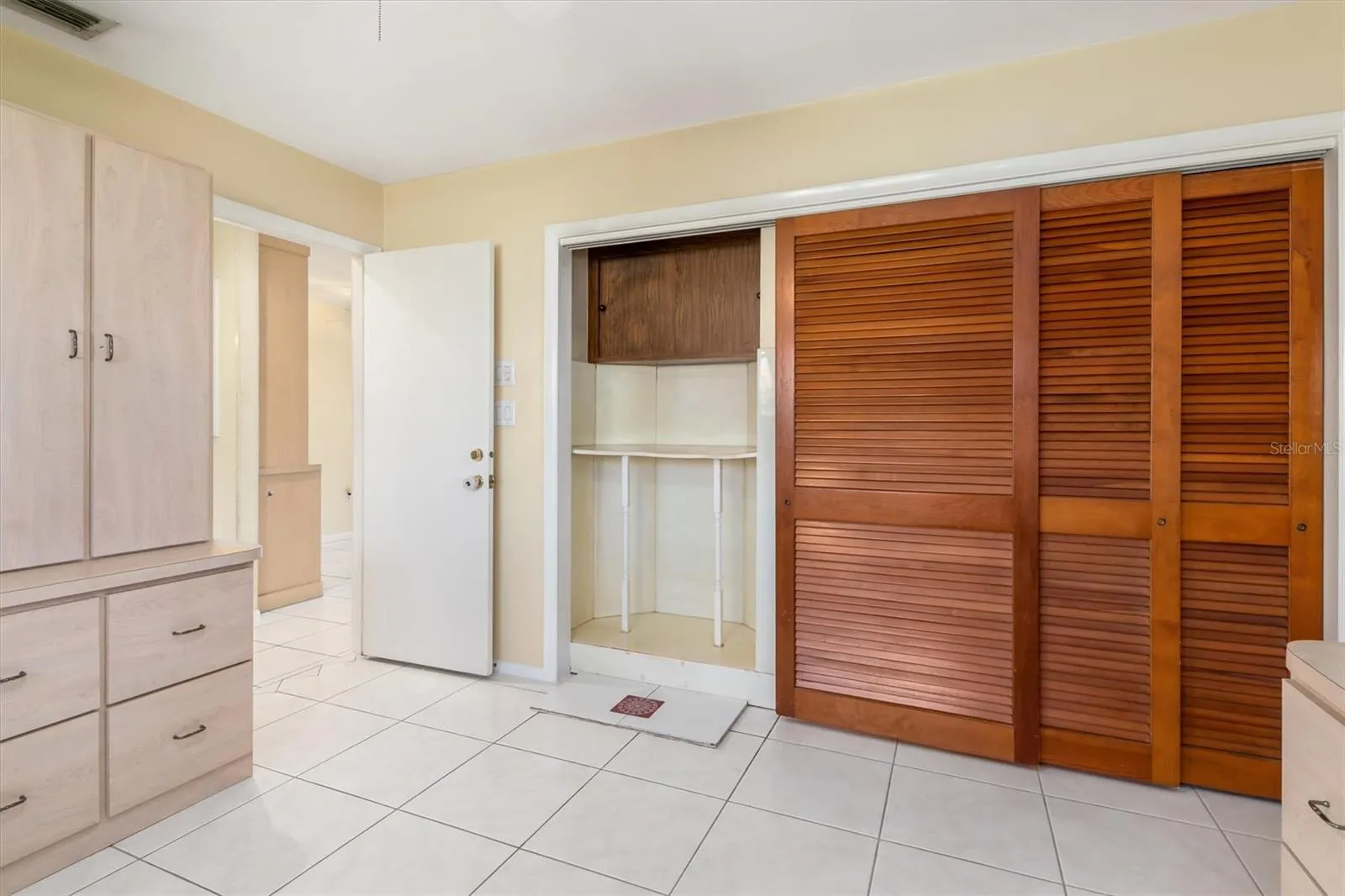 Bedroom 3 - Custom Cabinetry and large closet with wood sliding doors
