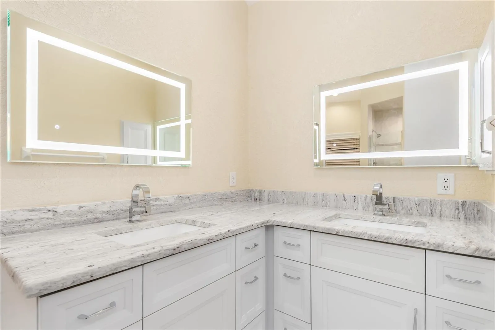 Primary Bathroom - Double Sinks, custom cabinets, Granite Counter Tops and Touch Mirrors