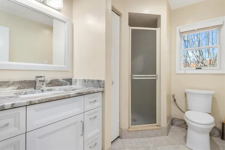 Bathroom 3 - Updated cabinets and Granite Counter Top with shower only
