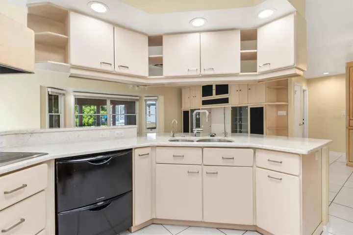 Custom Cabinets, Stainless Double Sink with Breakfast Bar