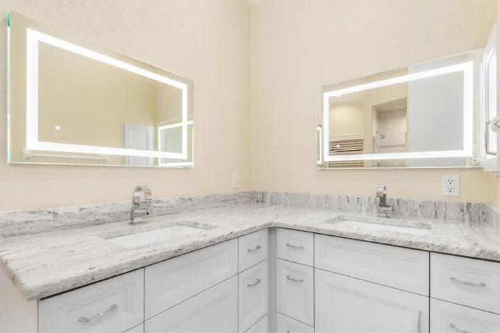 Primary Bathroom - Double Sinks, custom cabinets, Granite Counter Tops and Touch Mirrors