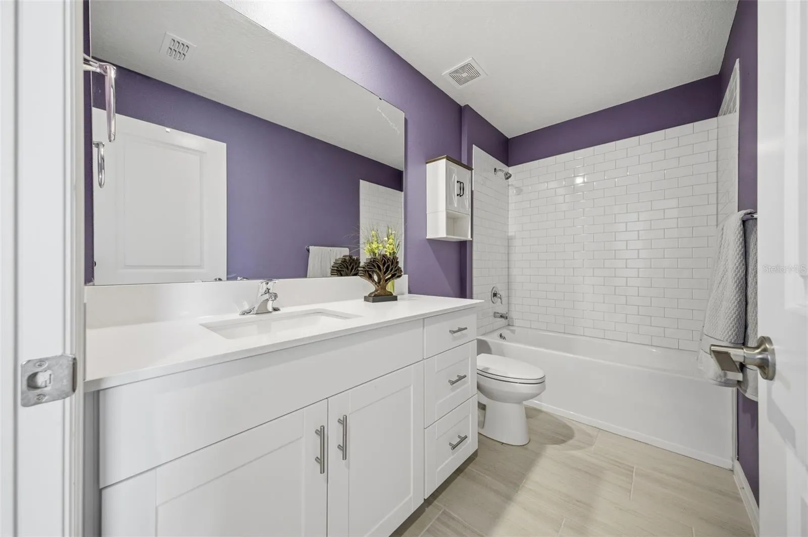 Second floor bathroom with tub and shower