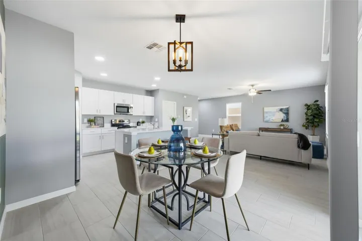 Dining room with view of living room and kitchen.