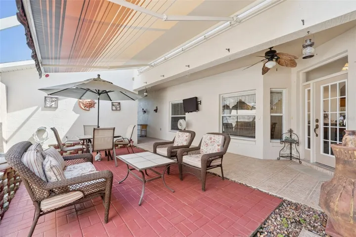 Private screened in courtyard, an ideal space to relax while enjoying the peaceful sounds of cascading water