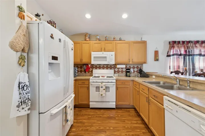 Kitchen features a Pantry, Recessed Lighting and Tile Backsplash