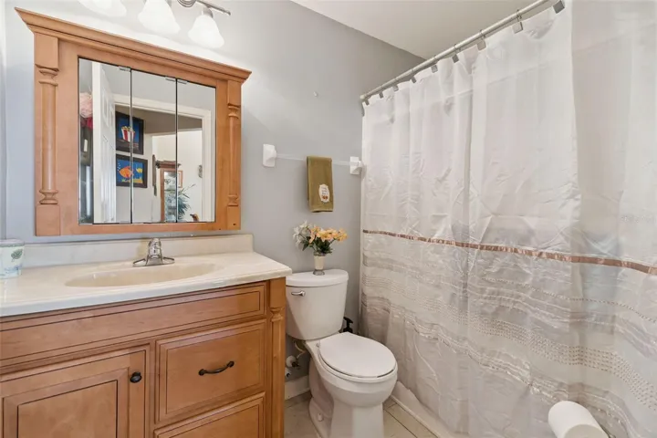 Guest Bathroom offers an updated Vanity, Mirror and Comfort Height Toilet