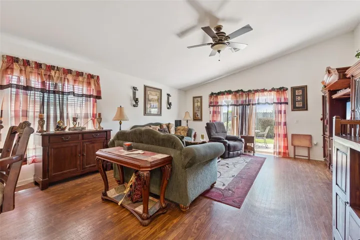 Great Room offers Glass Sliding Doors bringing the outdoor in