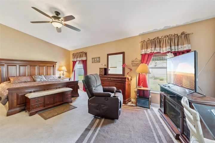 Spacious Primary Bedroom features a Sitting Area overlooking the courtyard