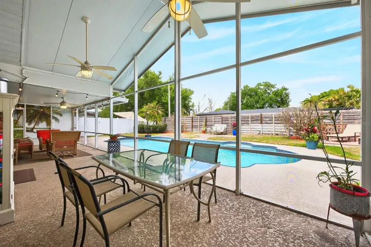 Enjoy the best of both worlds with a covered patio for relaxing in the shade, just steps from the inviting pool.