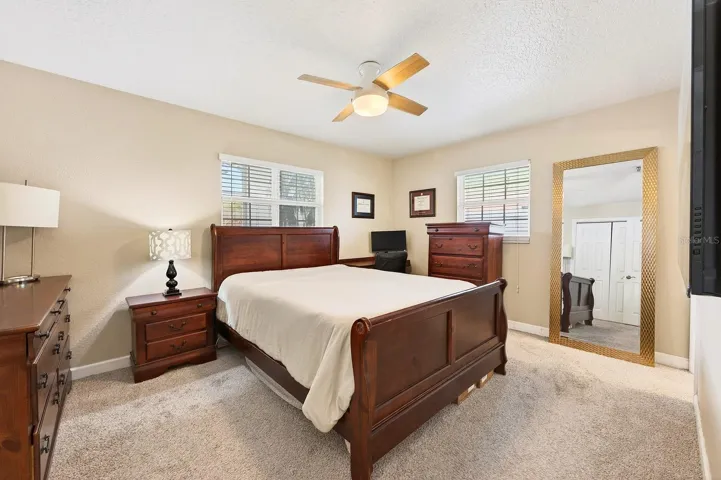 The Primary Suite offers a peaceful retreat with luxury carpeting and an updated en suite bath.