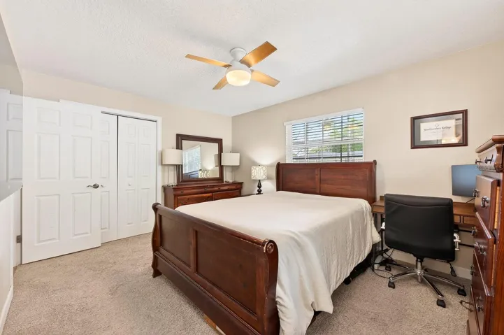 The Primary Suite offers a peaceful retreat with luxury carpeting and an updated en suite bath.