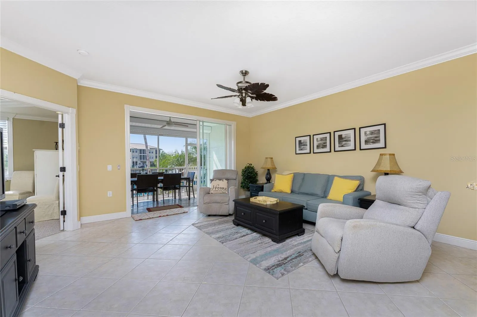 The living room has it all — open space, natural light,  water view and  balmy breezes capturing the beauty of tropical living