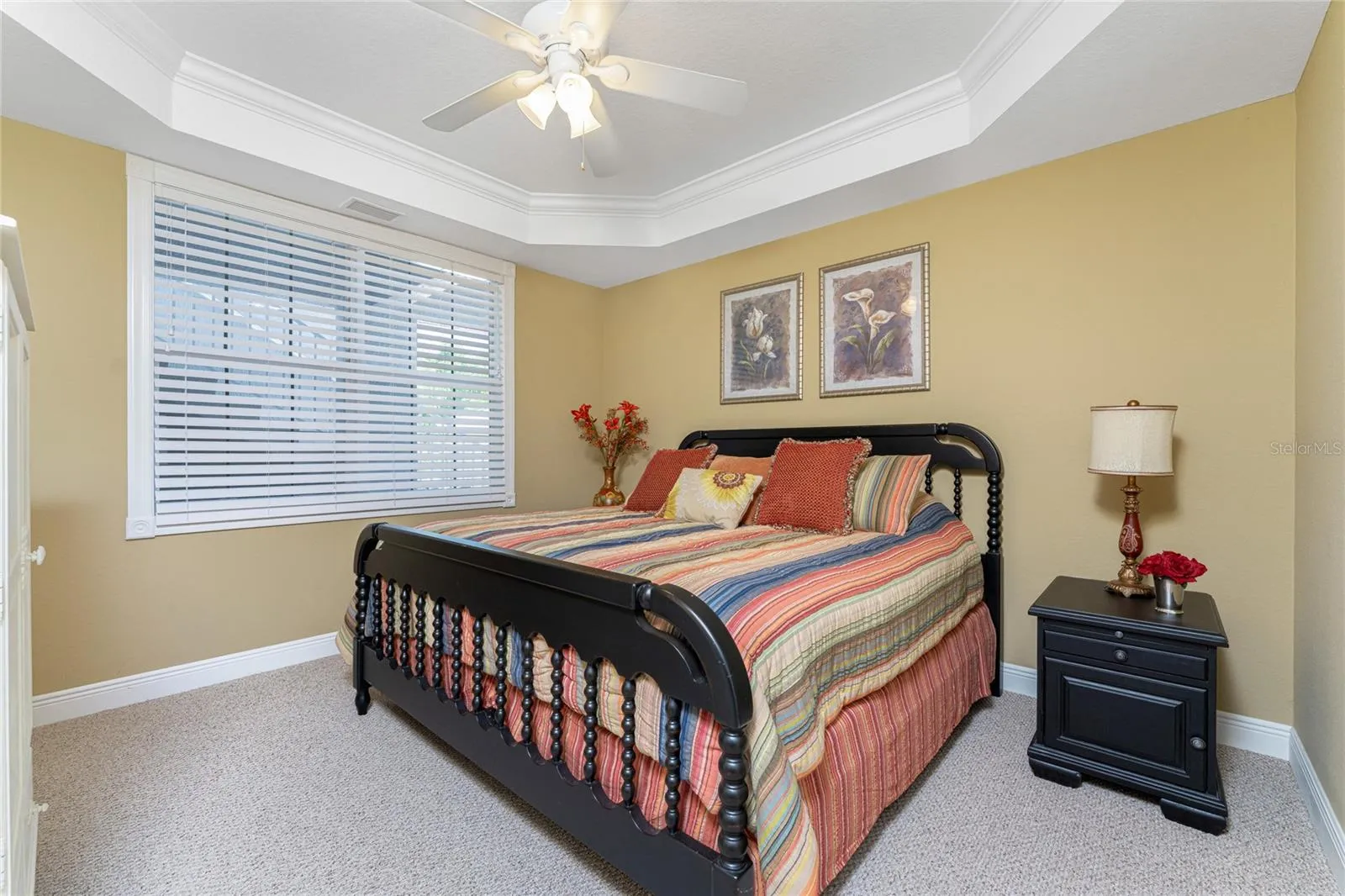 From the soaring tray ceiling to the soft natural light, this bedroom is where luxury meets total peace.