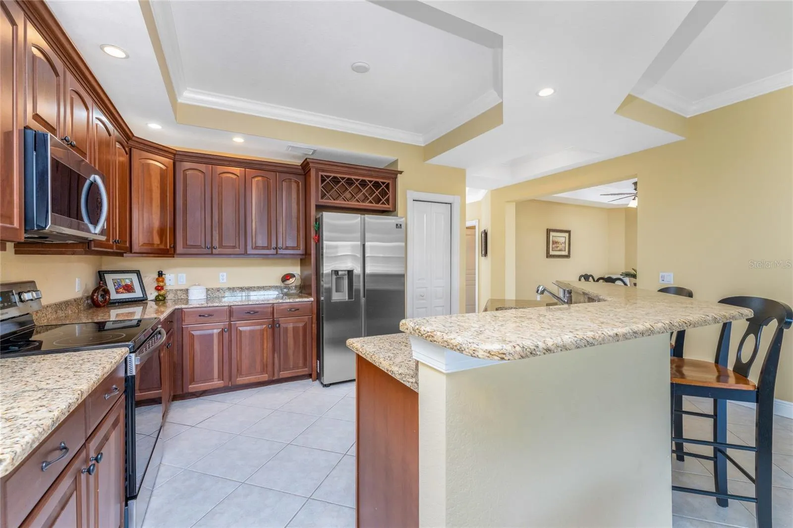 A well designed kitchen with storage and style — the built-in wine rack,  and slide-out extension shelves deliver a kitchen that works as beautifully as it looks.