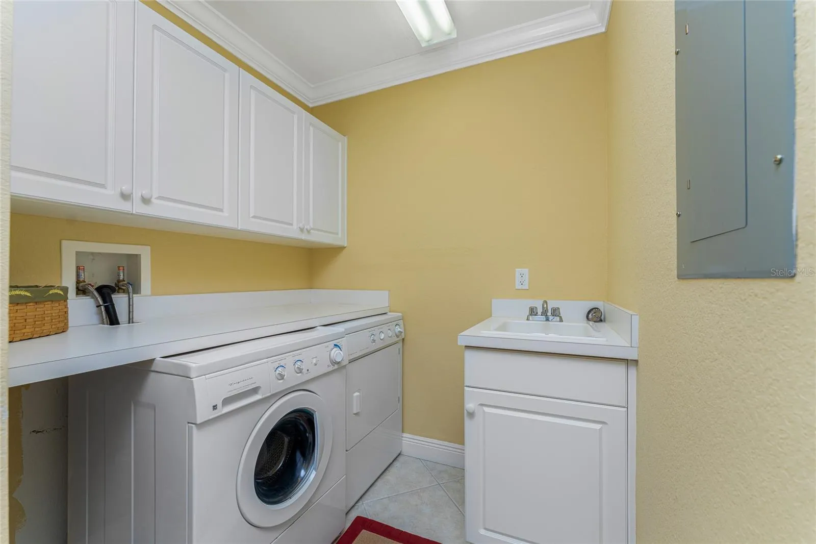 The laundry room you never knew you needed — expertly designed with a built-in folding table, proving that the best homes think of everything.