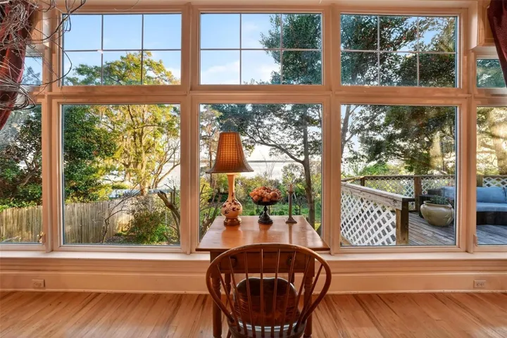 “Walls of windows in the Great Room draw in natural light and showcase serene views of Lake Dora, creating an inviting lakeside retreat that feels peaceful, open, and unforgettable.”