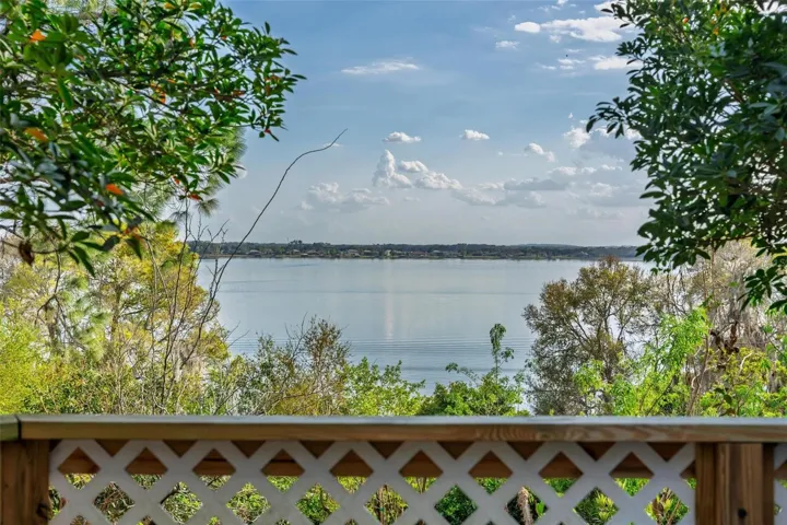 “Overlooking the sparkling waters of Lake Dora, this private deck extends the home’s living space outdoors with a peaceful, picturesque setting.”