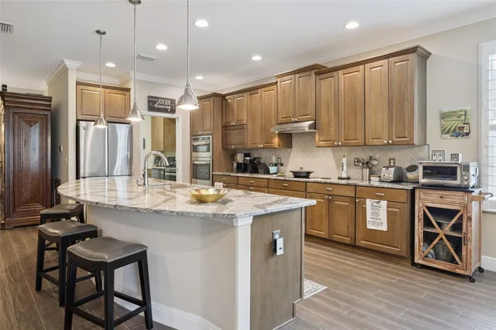 Eyebrow kitchen island. Can you spot the appliance garage?