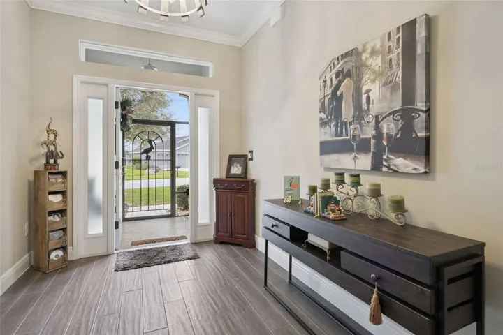 Wide screen door entry prior to the front door that opens outwards so Hurricane winds cannot effect it!