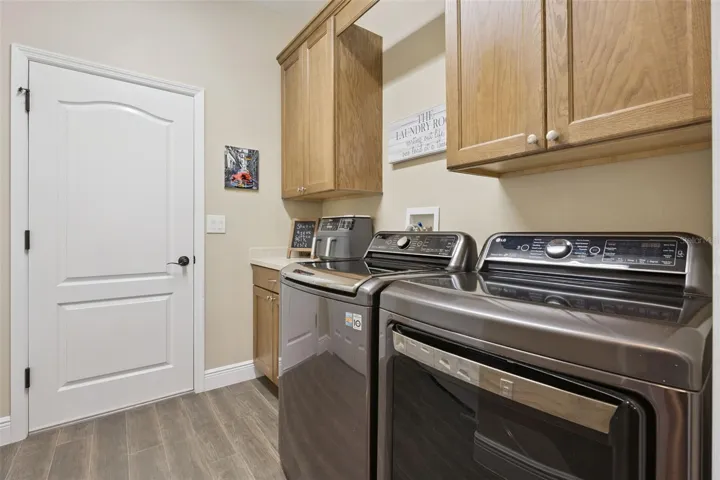 Upscale laundry pair convey with the sale. Additional cabinetry creates extra storage space.