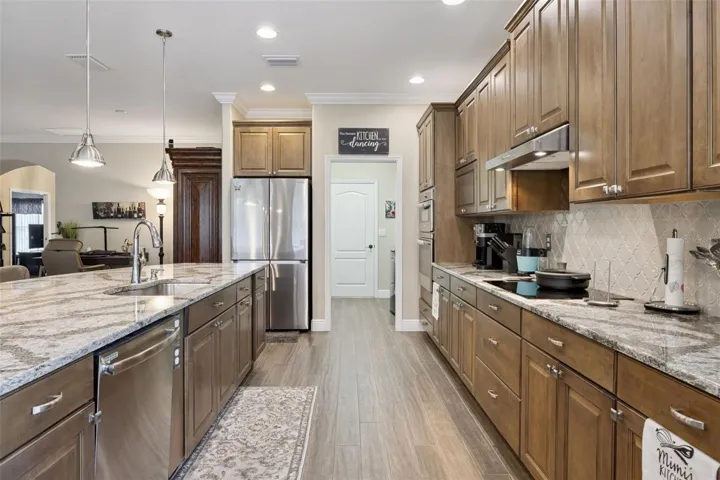 Pan drawers below the range and refrigerator moved to a more workable area.