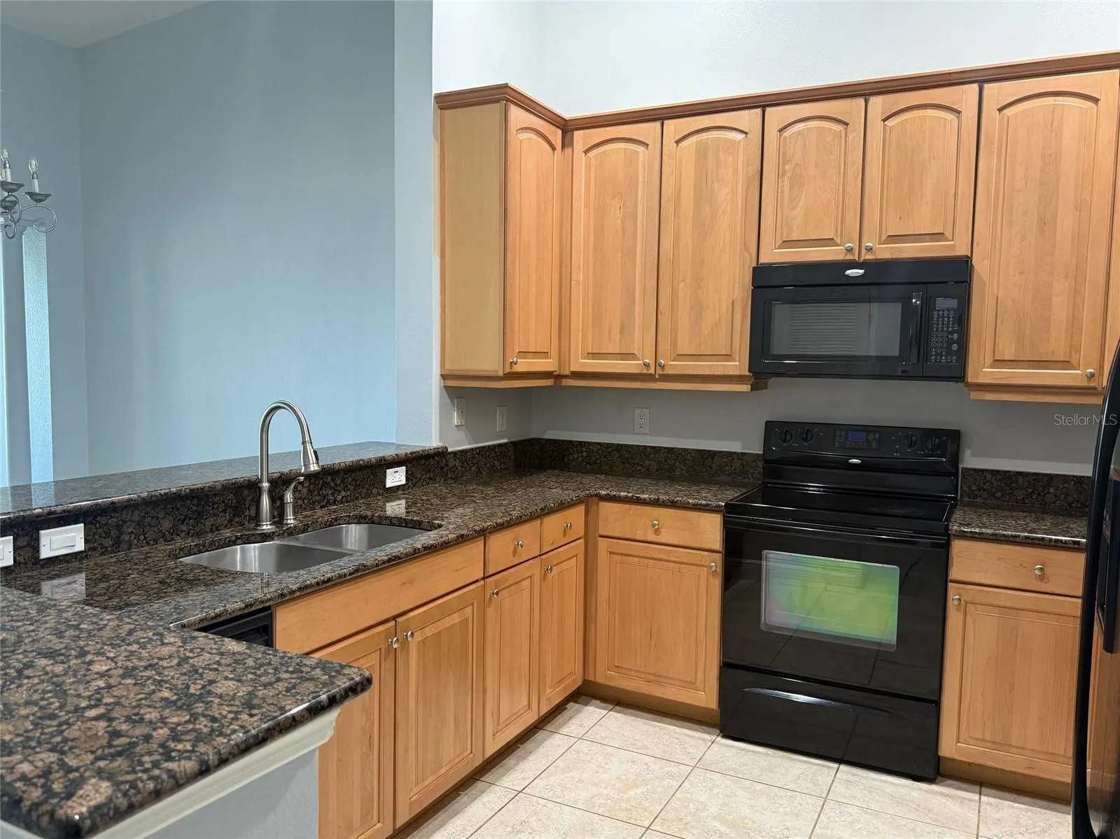 Granite Kitchen With Tall 42" Upper Wood Cabinets
