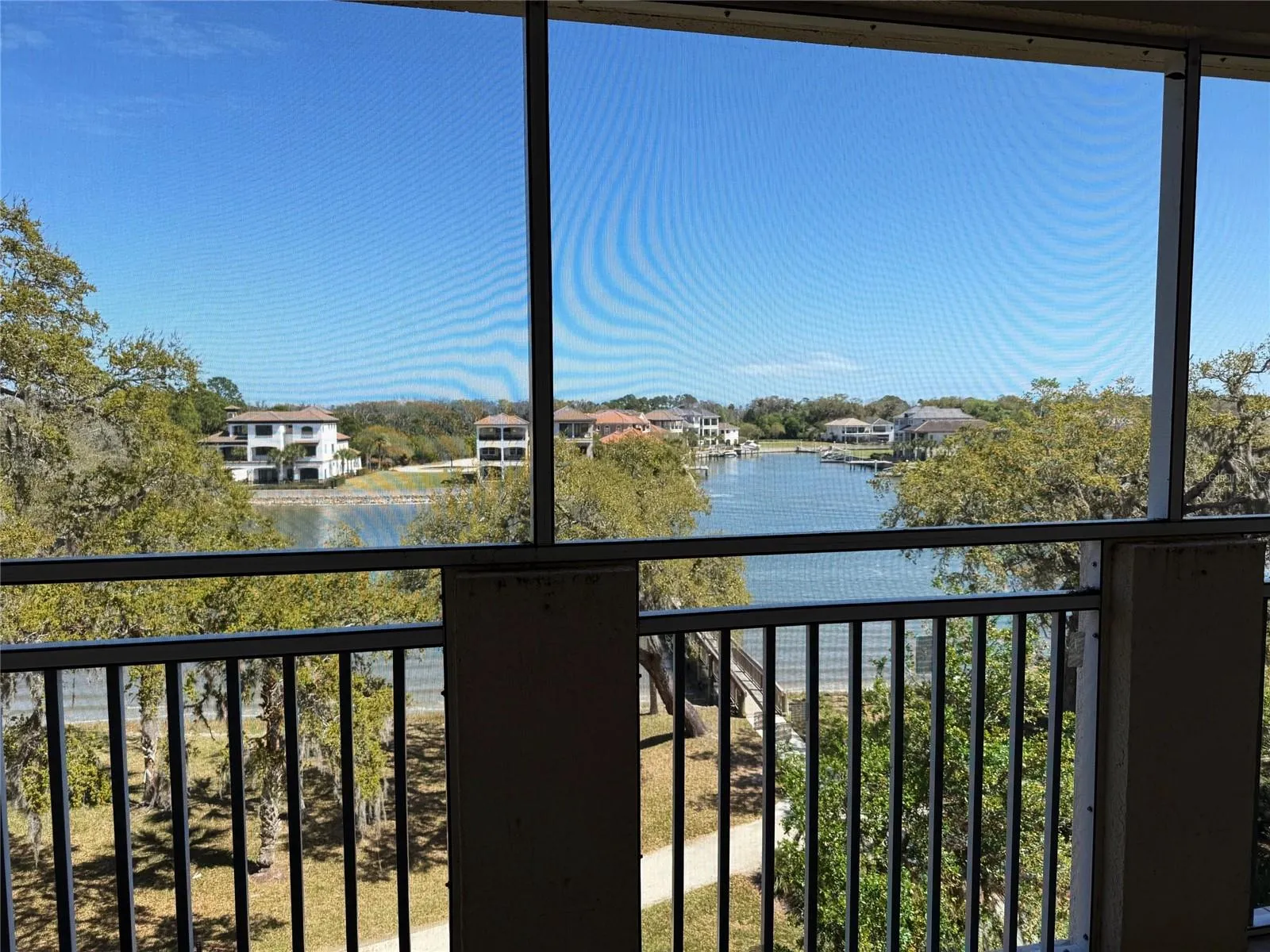UNSTAGED TILED PATIO: The Patio Has Unrivaled Water Views
